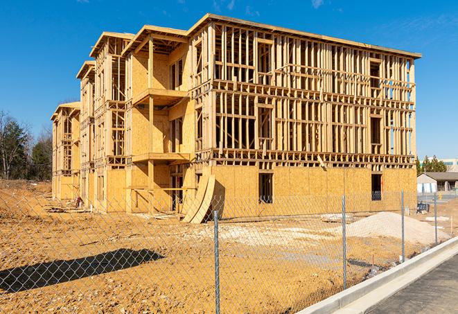 a temporary chain link fence locking away a building under renovation, serving as a security tool in Cerritos, CA